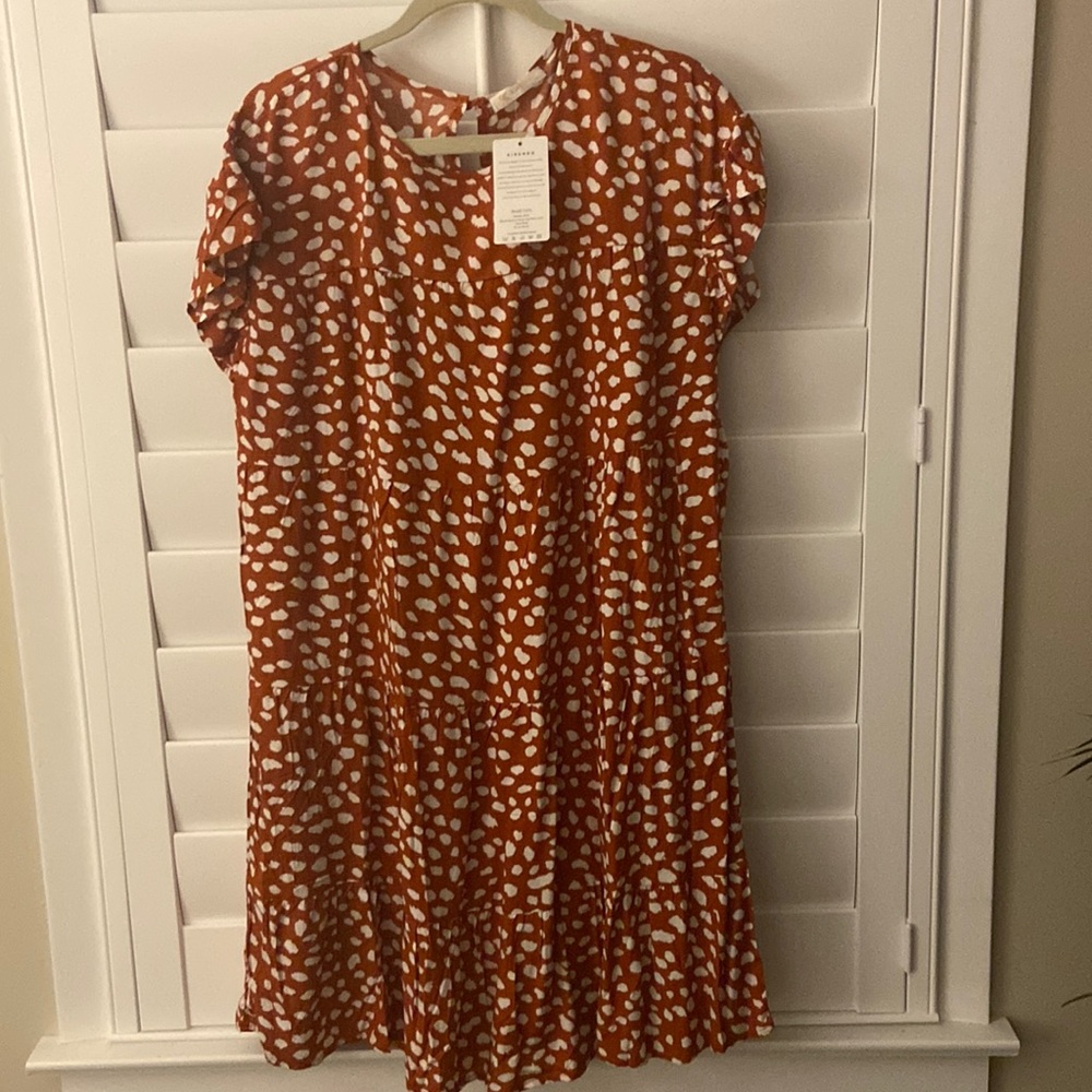 Ruffled sleeves on this make it so cute!!  Rust color is gorgeous!